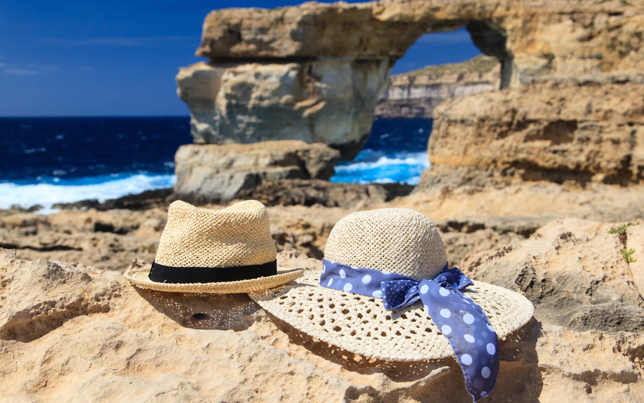 Two,Hats,At,Azure,Window,On,Gozo,Island,,Vacation,In
